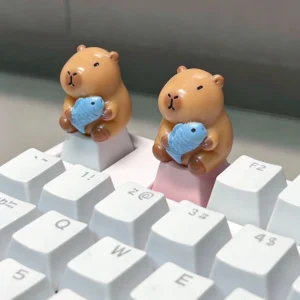 3d detailansicht von niedlicher capybara tastenkappe mit blauem fisch artisan custom keycap