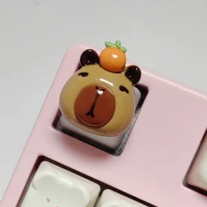 3d gloenzende capybara tastenkappe mit orange auf mechanischer tastatur