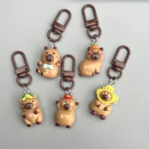 5-teiliges Set aus glänzenden Harz Capybara Taschenanhänger in einer Reihe, mit fünf verschiedenen Motiven für Taschen und Schlüssel