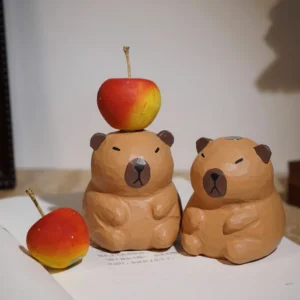 Capybara Figur mit Magnet Apfel - holzartige handgeschnitzte Dekofigur
