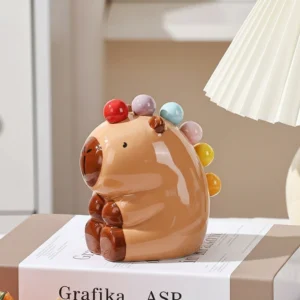 Sitzender Capybara Keramikhalter für Obstgabeln von vorne