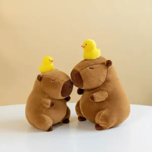Zen Capybara Stofftier mit gelber Ente aus der Seitenansicht
