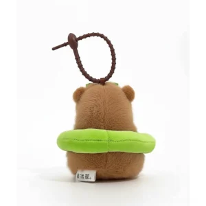 Capybara Plüsch-Anhänger mit grünem Frosch Schwimmreifen, hängt an Metallverschluss