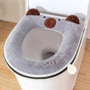 Graue Plüsch WC-Sitzauflage mit Capybara Motiv und Reißverschluss