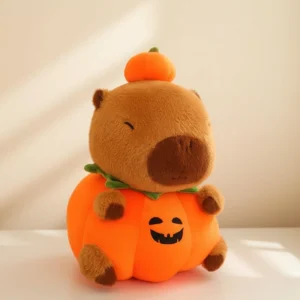 Halloween Capybara Kuscheltier im orangen Kürbis Kostüm mit kleiner Kürbis Mütze