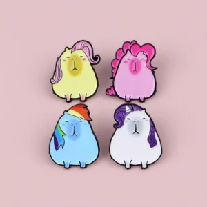 magic-pony-capybara-anstecknadel-set-vier-emaille-pins-mit-regenbogen-pink-lila-und-gelben-manen