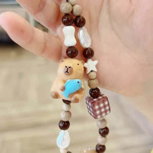 capybara handy-anhaenger detailansicht der perlen und des 3d capybara