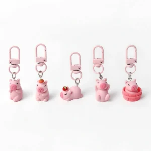 5-teiliges Set Sakura Pink Capybara Taschenanhänger auf weißem Hintergrund