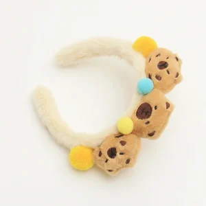 Weicher Capybara Stirnband mit farbigen Pompons für Hautpflege und Styling