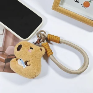 Plüsch Capybara Handy-Anhänger mit braunem Handgurt, Capybara mit Fisch Design